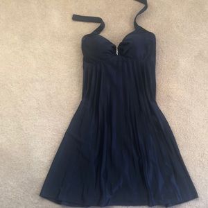 Baby doll style pleated dress with rhinestone pin